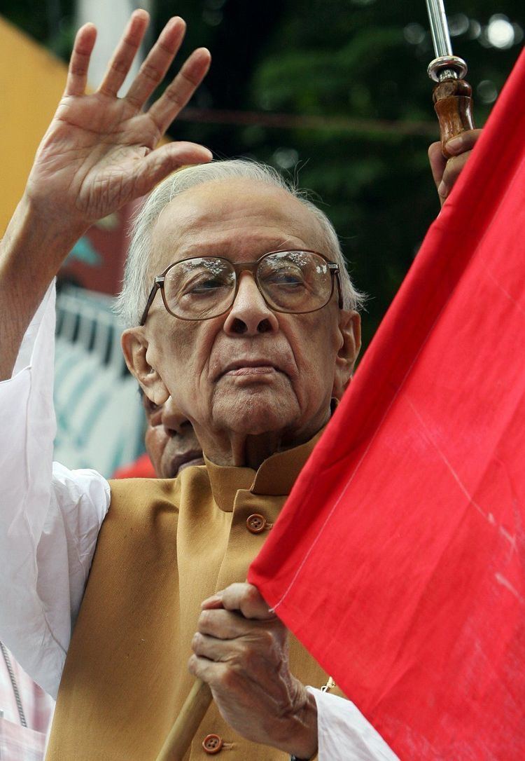 Jyoti Basu raises her hand during a protest in Kolkata