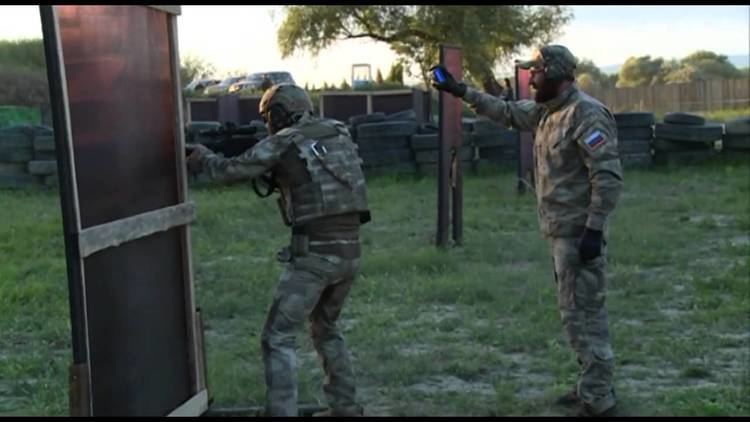 Kadyrovtsy men having a firearm training