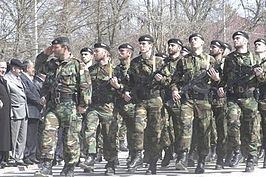 A group of Chechen security forces marching with firearms