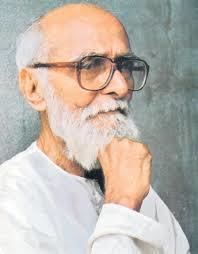 Kaloji Narayana Rao looking serious with his mustache and beard and his right hand on his chin while wearing a white sleeve
