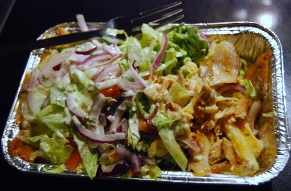 Kapsalon KAPSALON is the name for a dish with a layer chips shoarma and