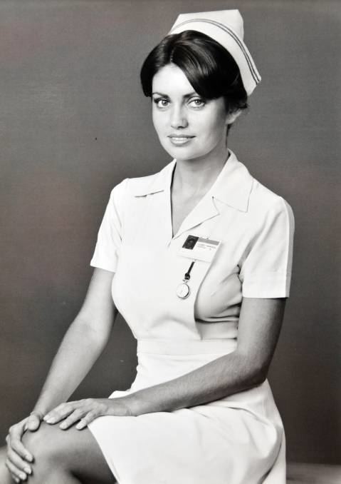 Karen Pini smiling while wearing a nurse uniform