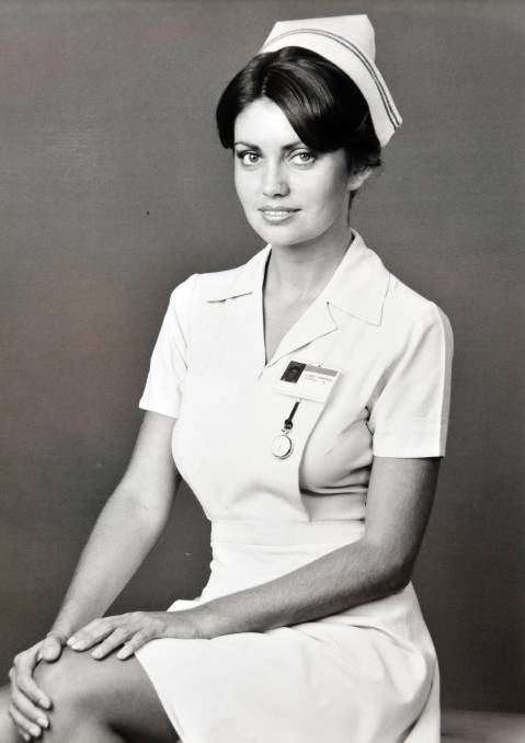 Karen Pini smiling while wearing a nurse uniform.