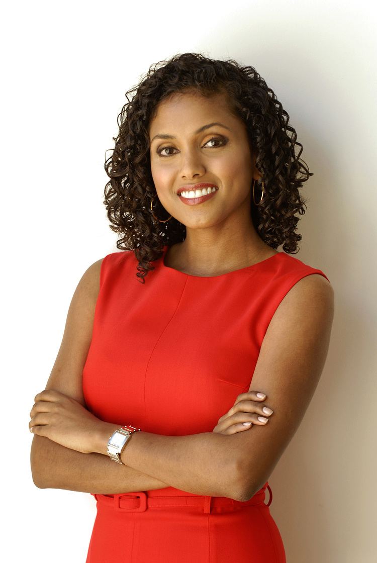 Karina Carvalho wearing a red dress