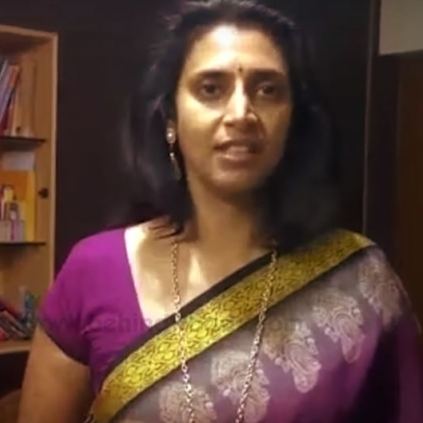 Kasthuri wearing a yellow and violet dress, earrings and necklace