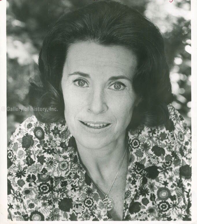 Katherine MacGregor wearing a floral dress