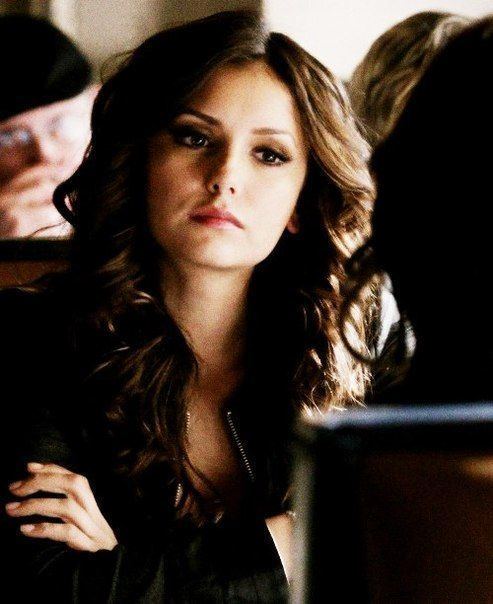 Katherine Pierce in her curly hair while wearing black jacket