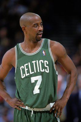 Kenny Anderson wearing a green basketball uniform.