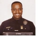 Kevin Gaines smiling while wearing a police uniform