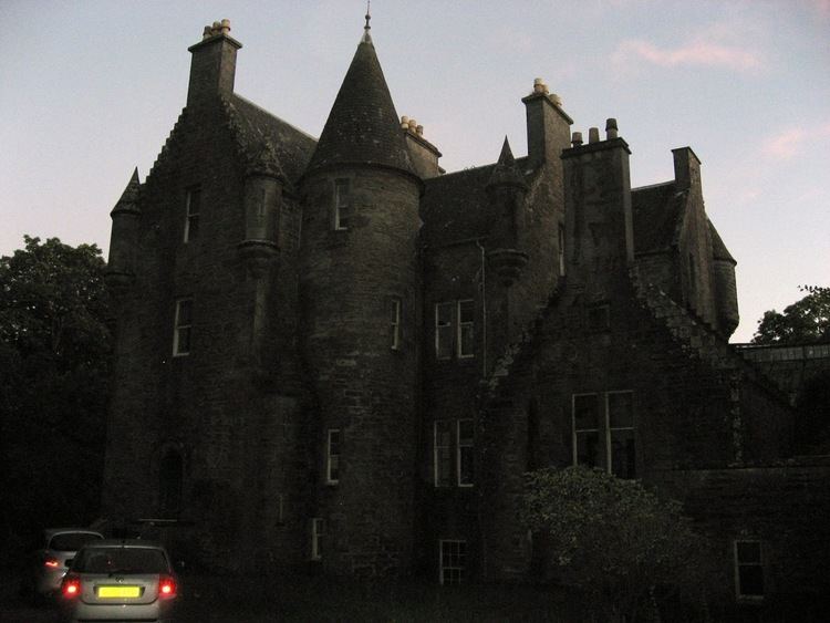 Kilberry Castle with two cars in front