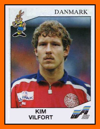 Kim Vilfort featured in a Danmark Football Card with thick curly hair and mustache and wearing red and blue collared shirt.