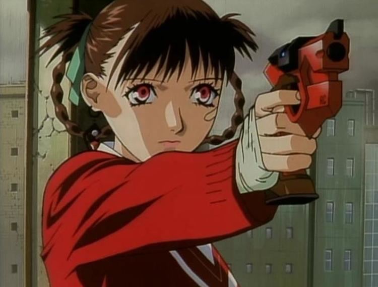Sawa holding a gun while wearing a red long sleeve blouse in a scene from the 1999 Japanese original video animation, Kite