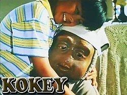 Kokey being hugged by Carlo as portrayed by Carlo Aquino in a scene from the movie Kokey, 1997.