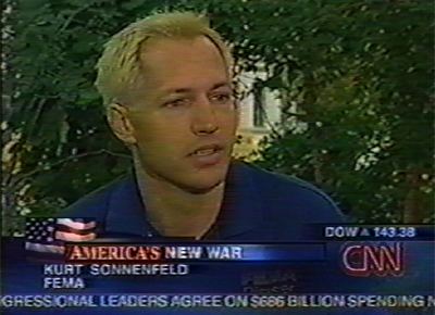 Kurt Sonnenfeld with blonde hair and wearing blue polo shirt during an interview with CNN.