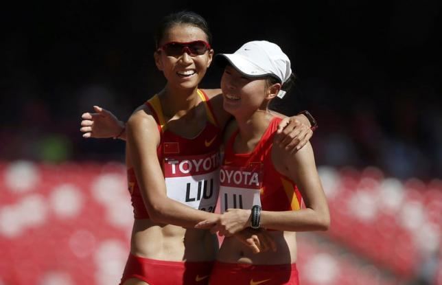 Lu Xiuzhi China duo walk tall as hosts claim first gold Reuters