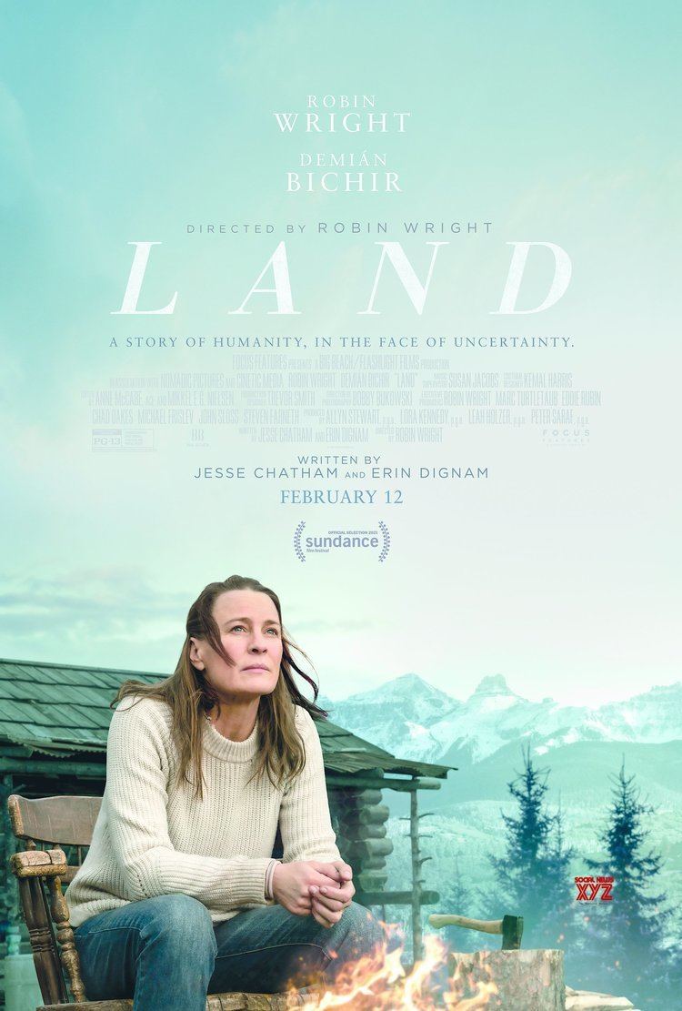 Robin Wright sitting on a chair and looking serious while wearing a white jacket and jeans in a movie poster of the 2021 Film "Land"
