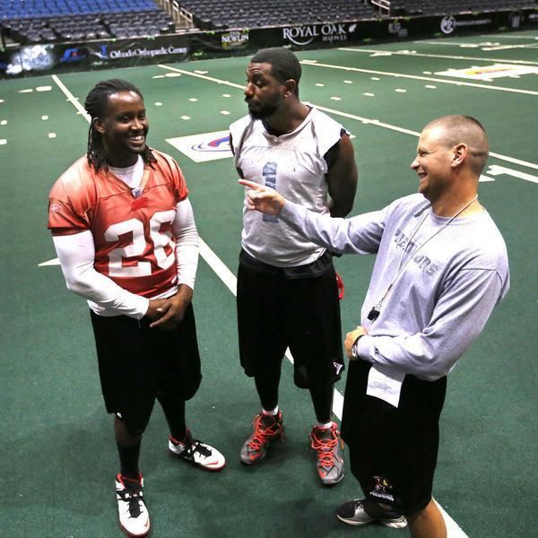 Larry Brackins Orlando Predators coach Rob Keefe jokes with defensive end