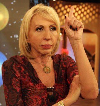 Peruvian television host Laura Bozzo, whose Laura show is a hit on the  U.S. Spanish network Telemundo, shows her passport during a news conference  in Lima, Peru, Wednesday, April 2, 2003. Bozzo