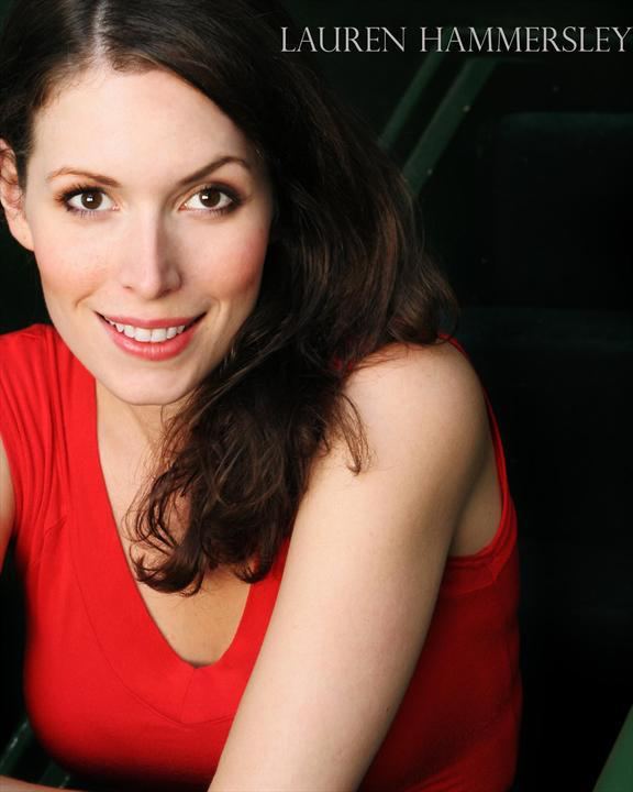 Lauren Hammersley smiling while wearing a red blouse