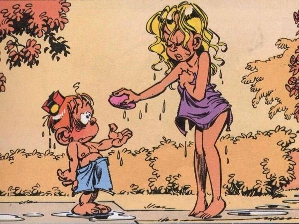 Spirou being handed a soap by his teacher Miss Claudia Chiffre from the comic strip Le Petit Spirou