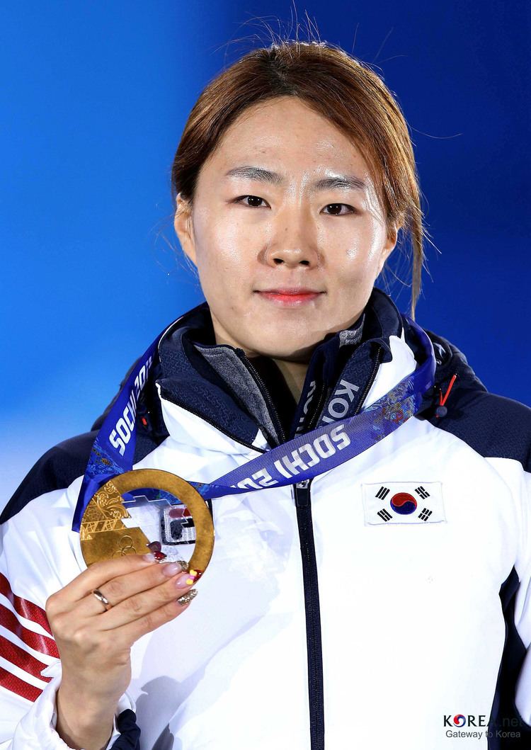 Lee Sang Hwa celebrates during the medal ceremony for the Women's 500m on day five of the Sochi 2014 Winter Olympics