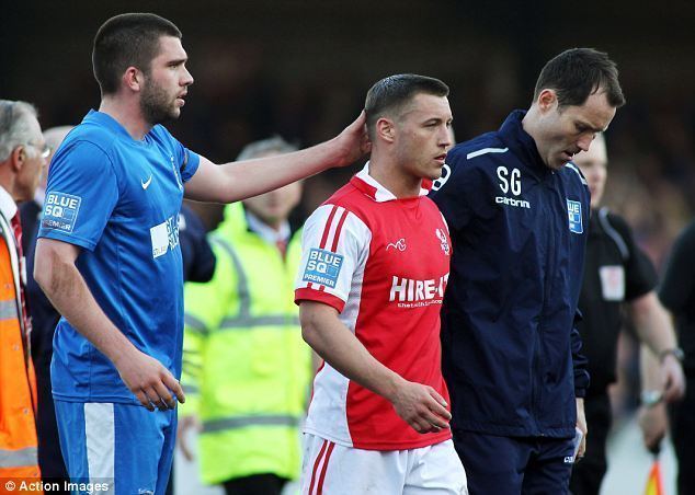 Lee Vaughan Kidderminster player PUNCHED by Stockport fan during pitch