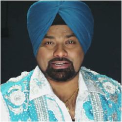 Lehmber Hussainpuri wearing a blue and white shirt and a blue turban type of headwear called pagri