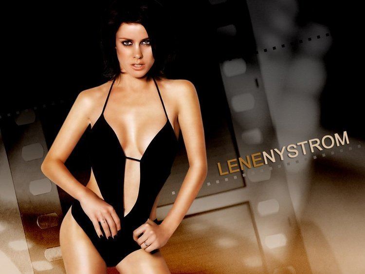 Lene Nystrøm with a fierce look while wearing a black swimsuit