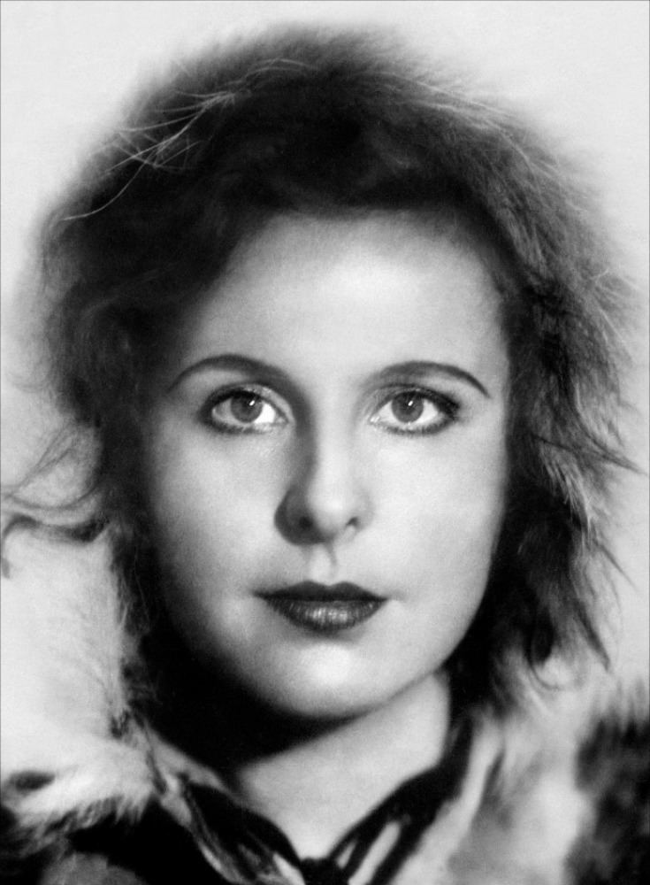 Leni Riefenstahl with a serious face and messy hair.