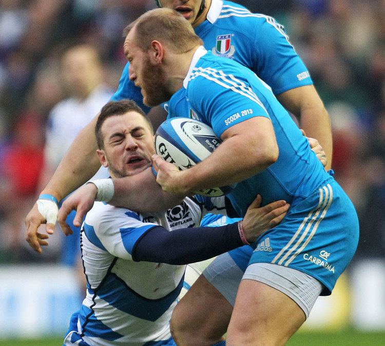 Leonardo Ghiraldini Scotland39s Greig Laidlaw feels the force of Italy39s