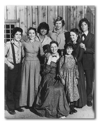 The cast of the TV series "Little House on the Prairie" (1974–1983) starring Melissa Gilbert as Laura Ingalls, Michael Landon as Charles Ingalls, and Leslie Landon as Etta Plum smiling together