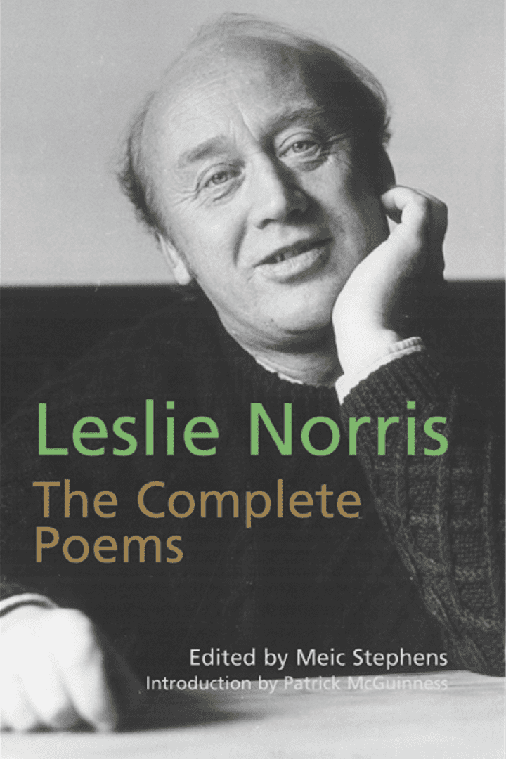 Leslie Norris featured on his own book, "The Complete Poems" with a smiling face, wearing a black knitted sweatshirt while holding his face.