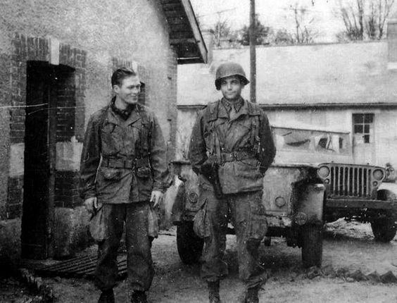 Dick Winters and Lewis Nixon smiling while wearing an army uniform