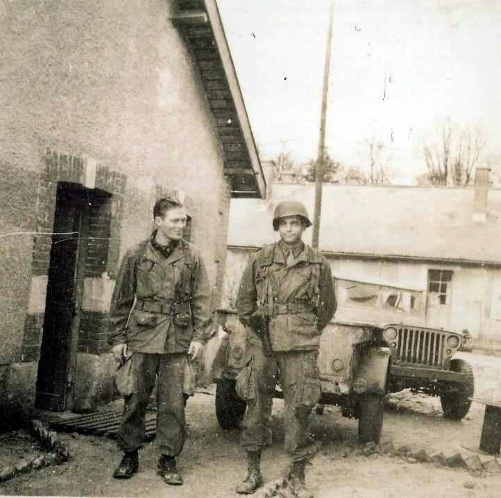 Dick Winters and Lewis Nixon smiling while wearing an army uniform