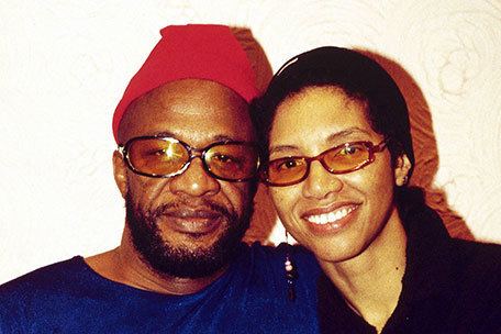 Cecil Womack smiling together with his wife Linda Womack both wearing eyelasses