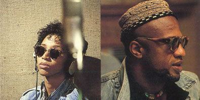 On the left is Linda Womack with a curly hair and wearing a denim, sunglasses and headset while on the right is Cecil Womack