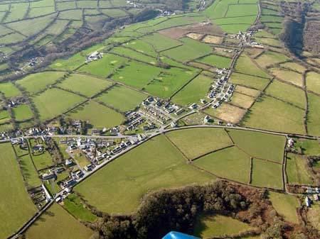 Continuous linear development of houses and bungalows along the old turnpike or A484 road