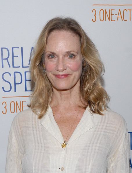 Lisa Emery smiling during the Meet and greet with the cast of the Broadway production of 'Relatively Speaking' at Sardi's restaurant, with blonde shoulder-length wavy hair, and wearing a necklace, earrings, and a white long sleeve blouse