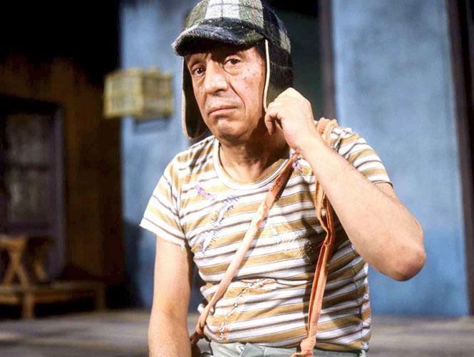 Roberto Gómez Bolaños as El Chavo wearing striped t-shirt and checkered cap