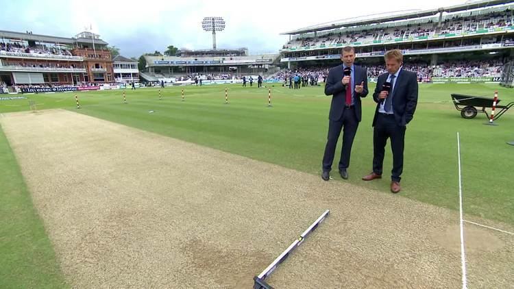 Reporters wearing suits and ties at the Lord's Cricket Ground.