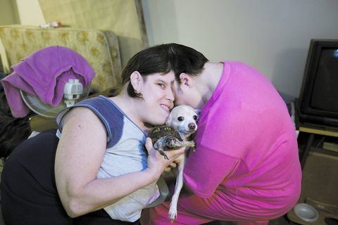 Lori and George Schappell with a dog.