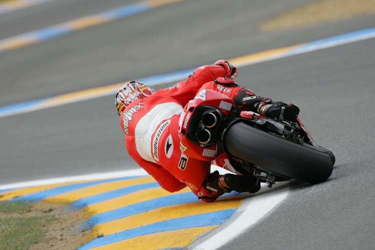 Loris Capirossi Loris Capirossi slides his Ducati perfectly at highspeed MotoGP