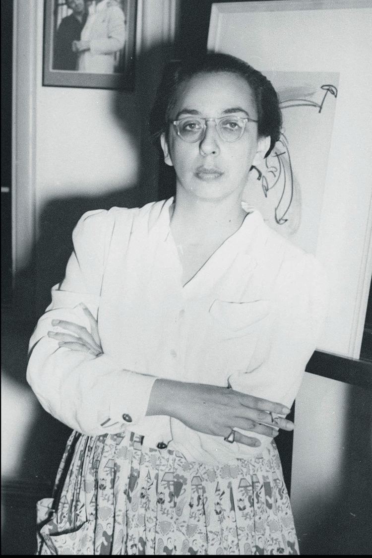 Lota de Macedo Soares wearing a dress and eyeglasses