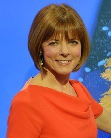 Louise Lear smiling and wearing red blouse