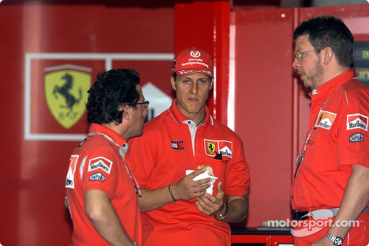Luca Baldisserri Michael Schumacher Ross Brawn and Luca Baldisserri at