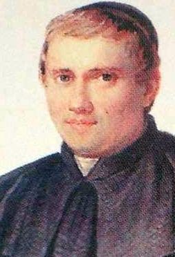 Luigi Caburlotto as featured in a calendar wearing black cassock (clergy garments) and a cap.