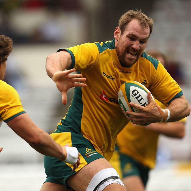 Luke Burgess (rugby union) Rocky Elsom tries to fend off Luke Burgess Rugby Union