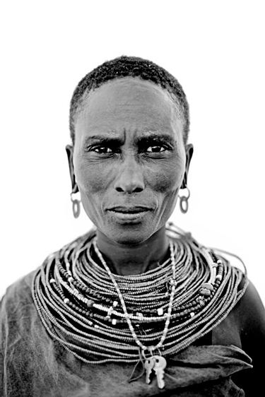 Portrait of a Samburu Warrior tribe wearing earrings and necklaces captured by Lyle Owerko.