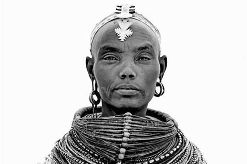 Portrait of a Samburu Warrior tribe with a serious face captured by Lyle Owerko.