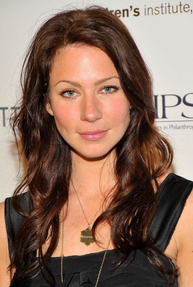 Lynn Collins wearing a black sleeveless shirt